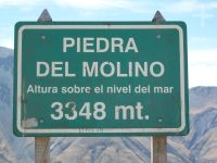 Sign marking the "Piedra del Molino" view point, on the top of the "Cuesta del Obispo" valley, province of Salta, Argentina