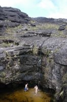 Tourists in a natural pool on Mount Roraima, Gran Sabana, south of Venezuela.