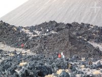 Tourists exploring a basalt flow, near Antofagasta de la Sierra, province of Catamarca, Argentina Tourists exploring a basalt flow, near Antofagasta de la Sierra, province of Catamarca, Argentina